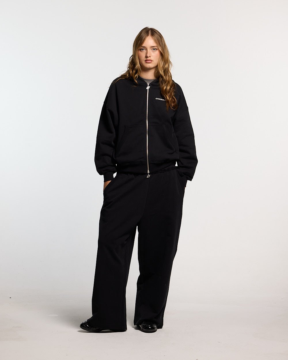 MIDNIGHT SET SWEATPANT BLACK - black logo print sweatpants, front view on female model - Cold Culture #woman