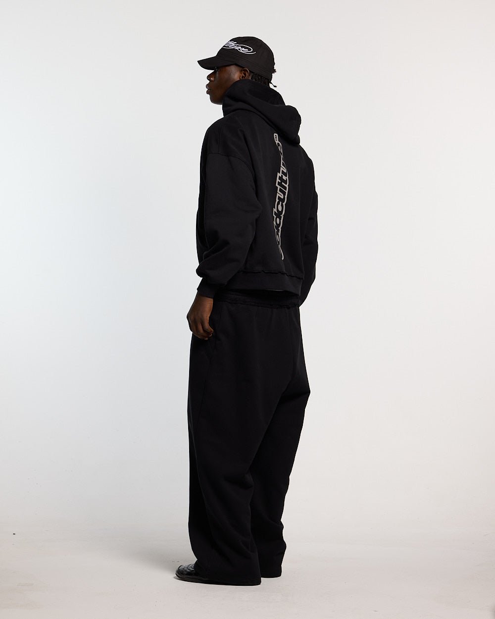 MIDNIGHT SET SWEATPANT BLACK - black logo print sweatpants, side view - Cold Culture #man