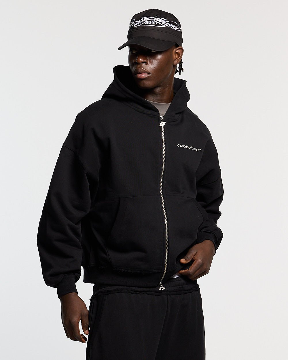 MIDNIGHT SET ZIP UP BLACK - black zip-up hoodie, front view on male model - Cold Culture #man