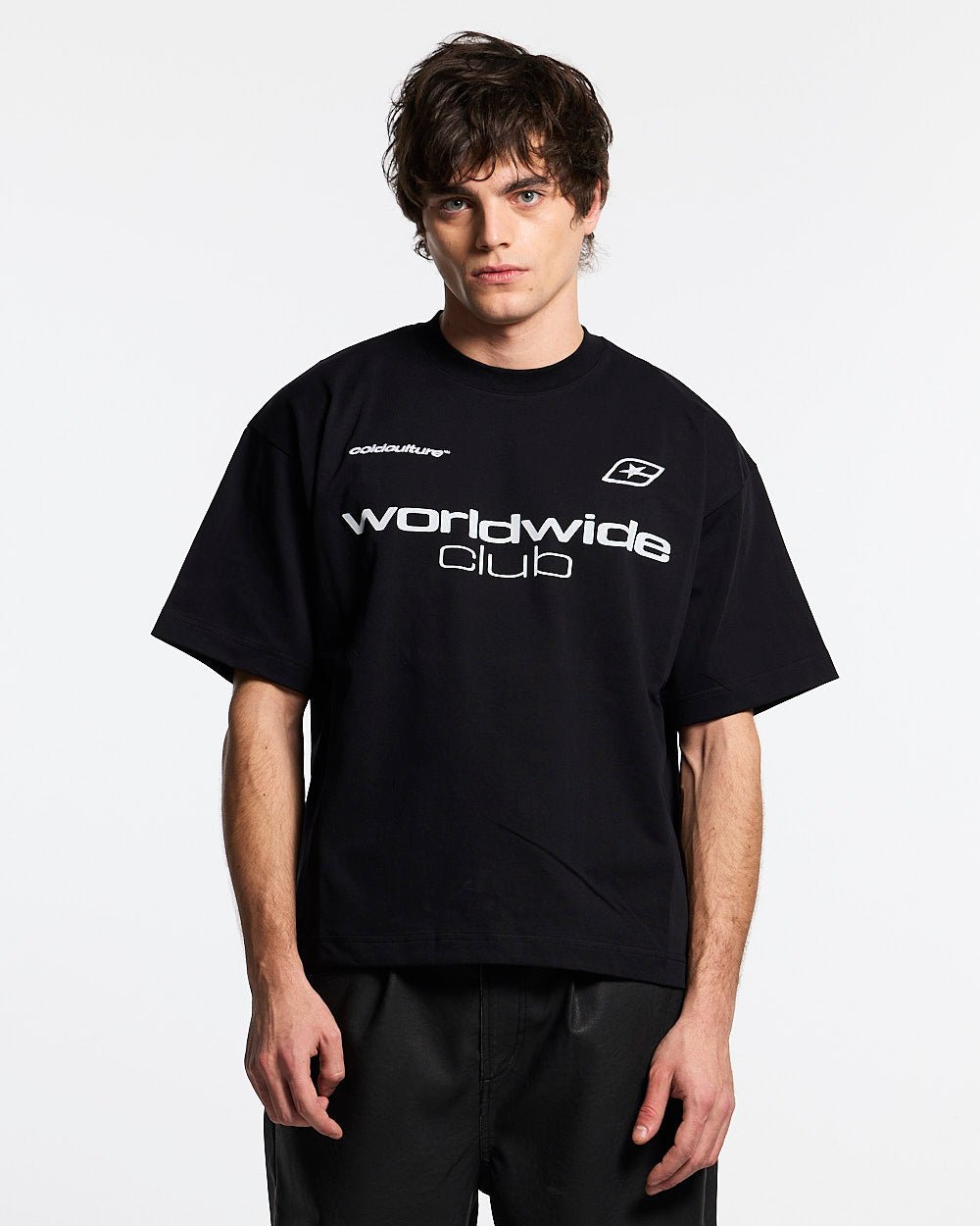 MR WORLDWIDE TEE BLACK - black graphic print tee, front view on male model - Cold Culture #man