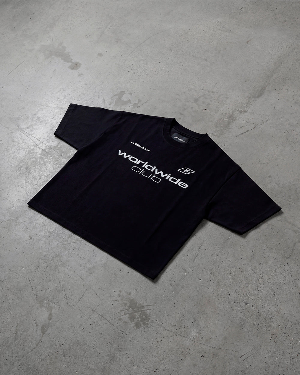 MR WORLDWIDE TEE BLACK - black graphic print tee, flat lay - Cold Culture