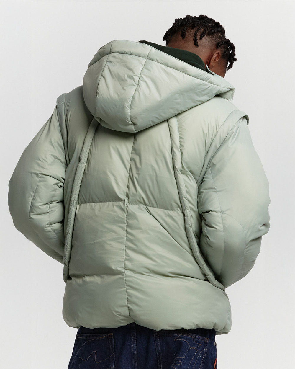 MULTIFUNCTIONAL PUFFER JACKET PISTACHIO GREEN - pistachio green hooded puffer jacket, back view on male model - Cold Culture #man