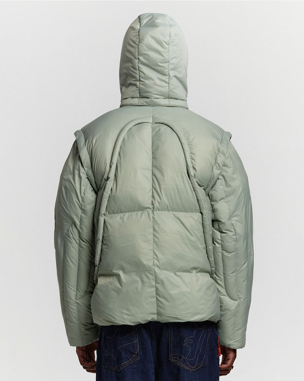 MULTIFUNCTIONAL PUFFER JACKET PISTACHIO GREEN - pistachio green hooded puffer jacket, back view on male model - Cold Culture