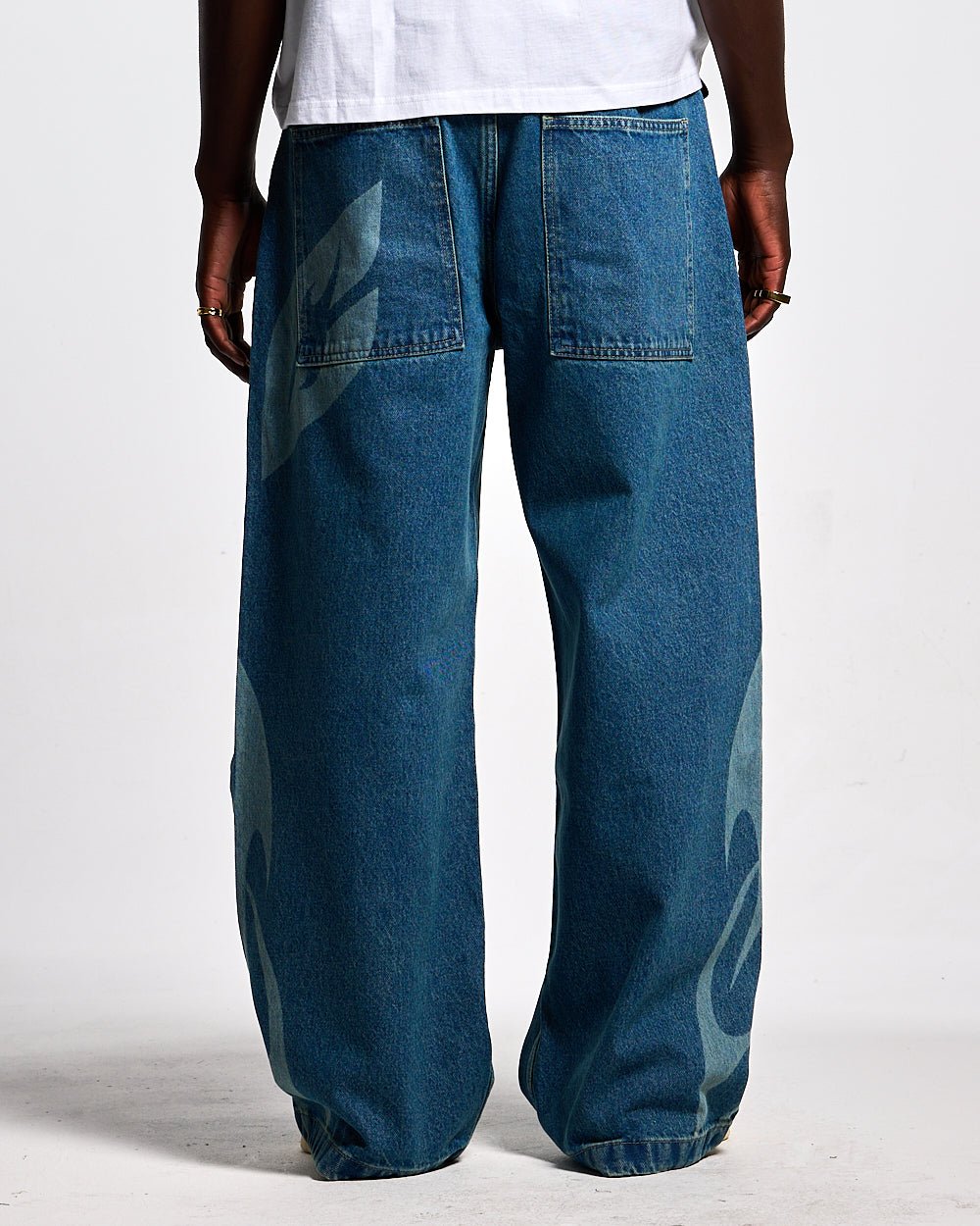 NEOTRIBAL V2 PANTS LIGHT BLUE DENIM - light blue tribal print denim pants, back view on male model - Cold Culture