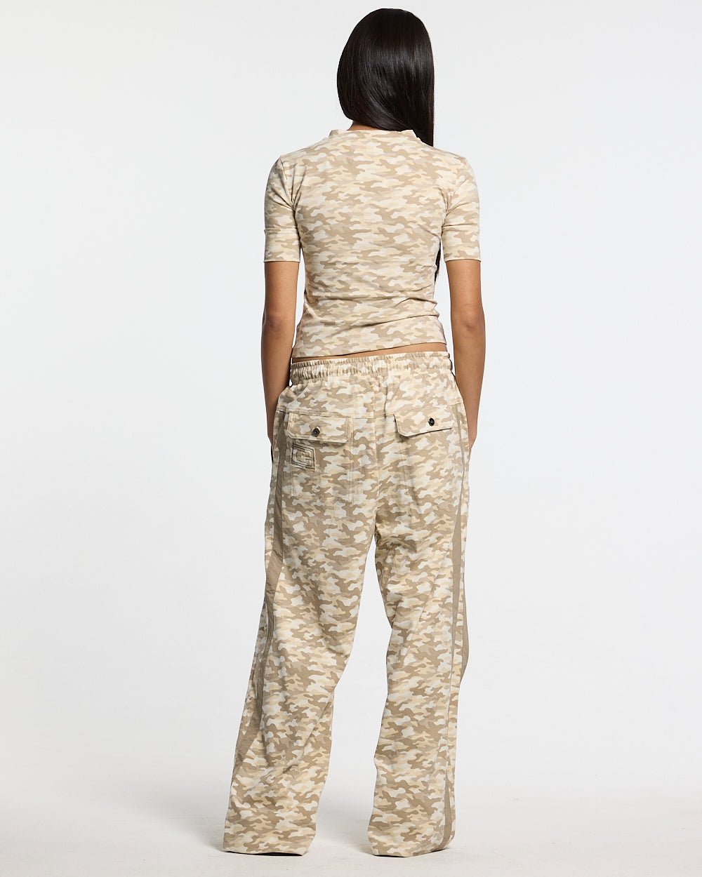 NEUTRAL FIELD BABY TEE CAMO - beige camo baby tee, back view on female model - Cold Culture #woman