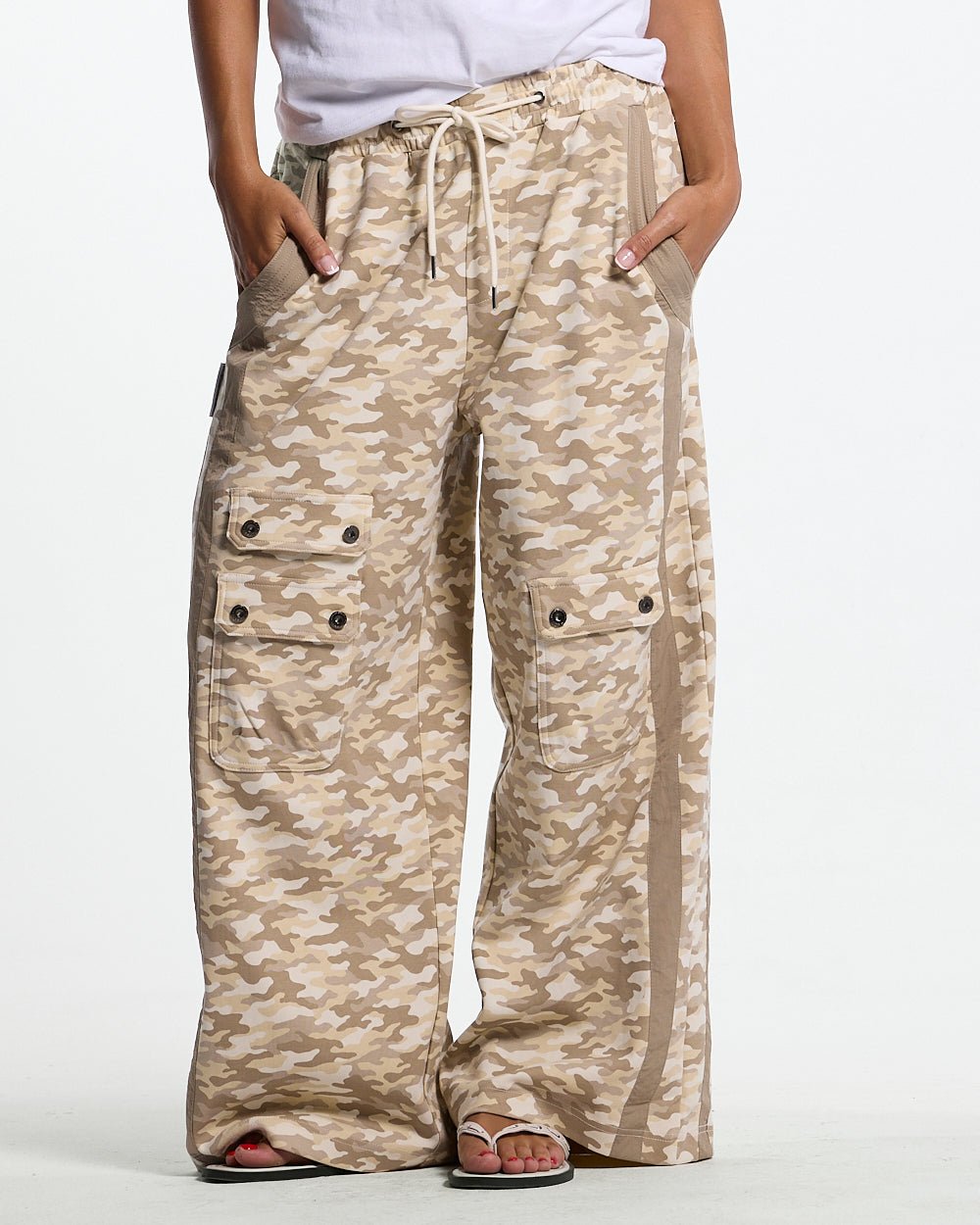 NEUTRAL FIELD SWEATPANTS CAMO - beige camo sweatpants, front view on female model - Cold Culture #woman