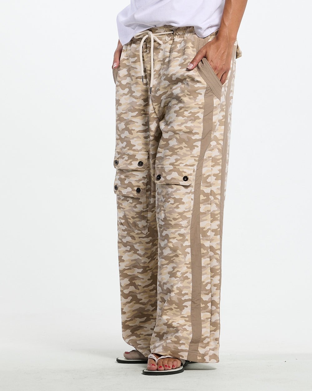 NEUTRAL FIELD SWEATPANTS CAMO - beige camo sweatpants, front view on female model - Cold Culture #woman