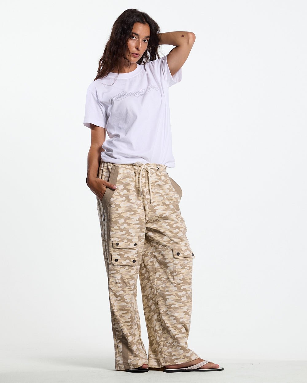 NEUTRAL FIELD SWEATPANTS CAMO - beige camo sweatpants, front view on female model - Cold Culture #woman
