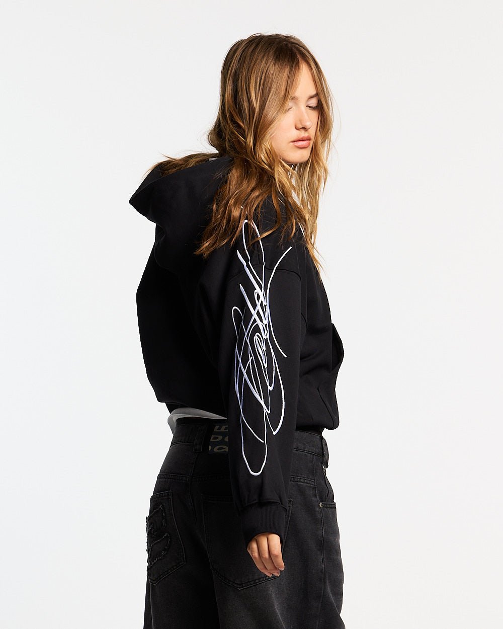 NEW SCRIPT ZIP HOODIE BLACK - black embroidered zip-up hoodie, side view - Cold Culture #woman