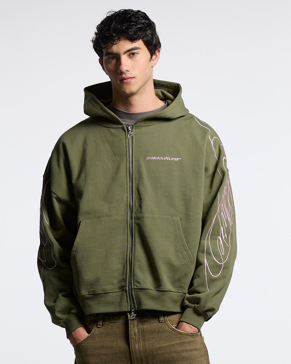 NEW SCRIPT ZIP HOODIE GREEN & PINK - olive green zip-up hoodie, front view on male model - Cold Culture #man