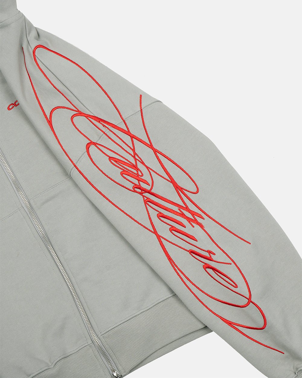NEW SCRIPT ZIP HOODIE GREY & RED - grey zip-up hoodie, detail close-up - Cold Culture