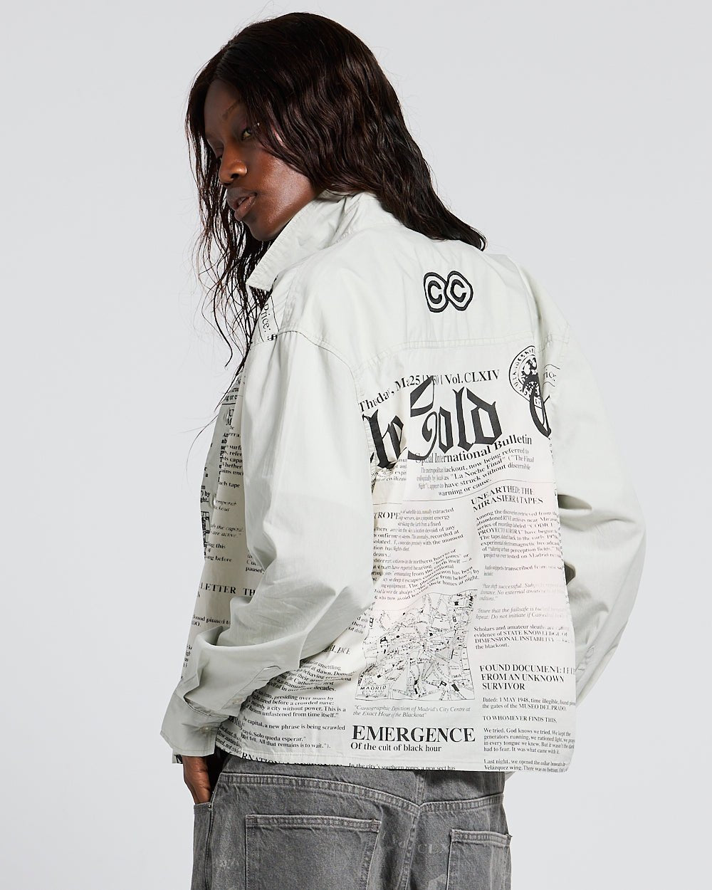 NEWSPAPER LONGSLEEVE SHIRT WHITE - white newspaper print shirt, back view on female model - Cold Culture #woman