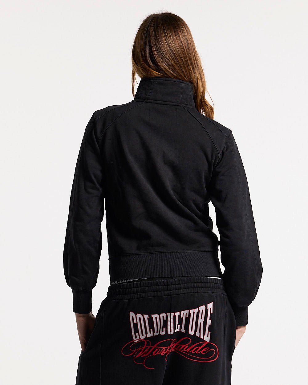 NIA SET ZIP UP BLACK - black graphic print zip-up hoodie, back view on female model - Cold Culture #woman