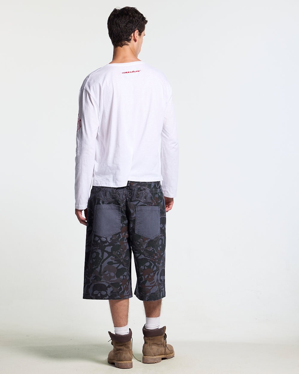 NIGHTSKULL SHORTS GREY - grey skull camo shorts, back view on male model - Cold Culture #man