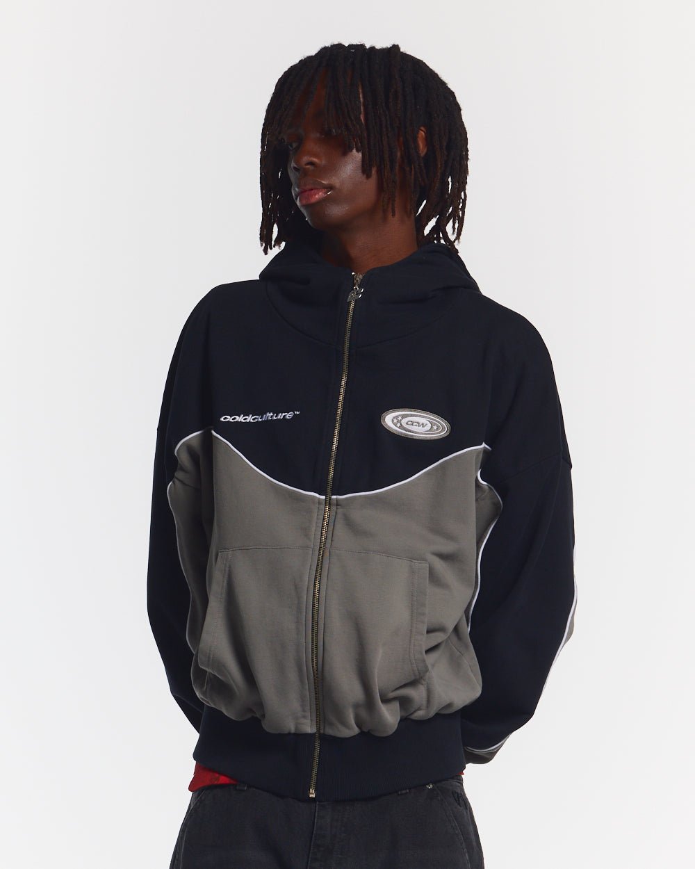 NO RISK ZIP HOODIE BLACK - black and grey colorblock zip-up hoodie, front view on male model - Cold Culture #man
