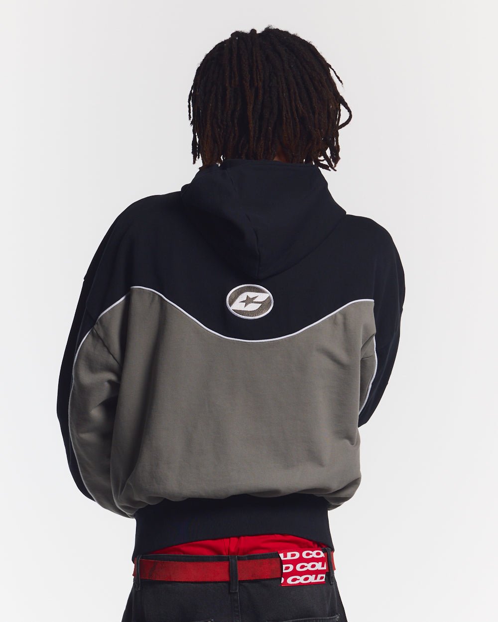 NO RISK ZIP HOODIE BLACK - black and grey colorblock zip-up hoodie, back view on male model - Cold Culture #man