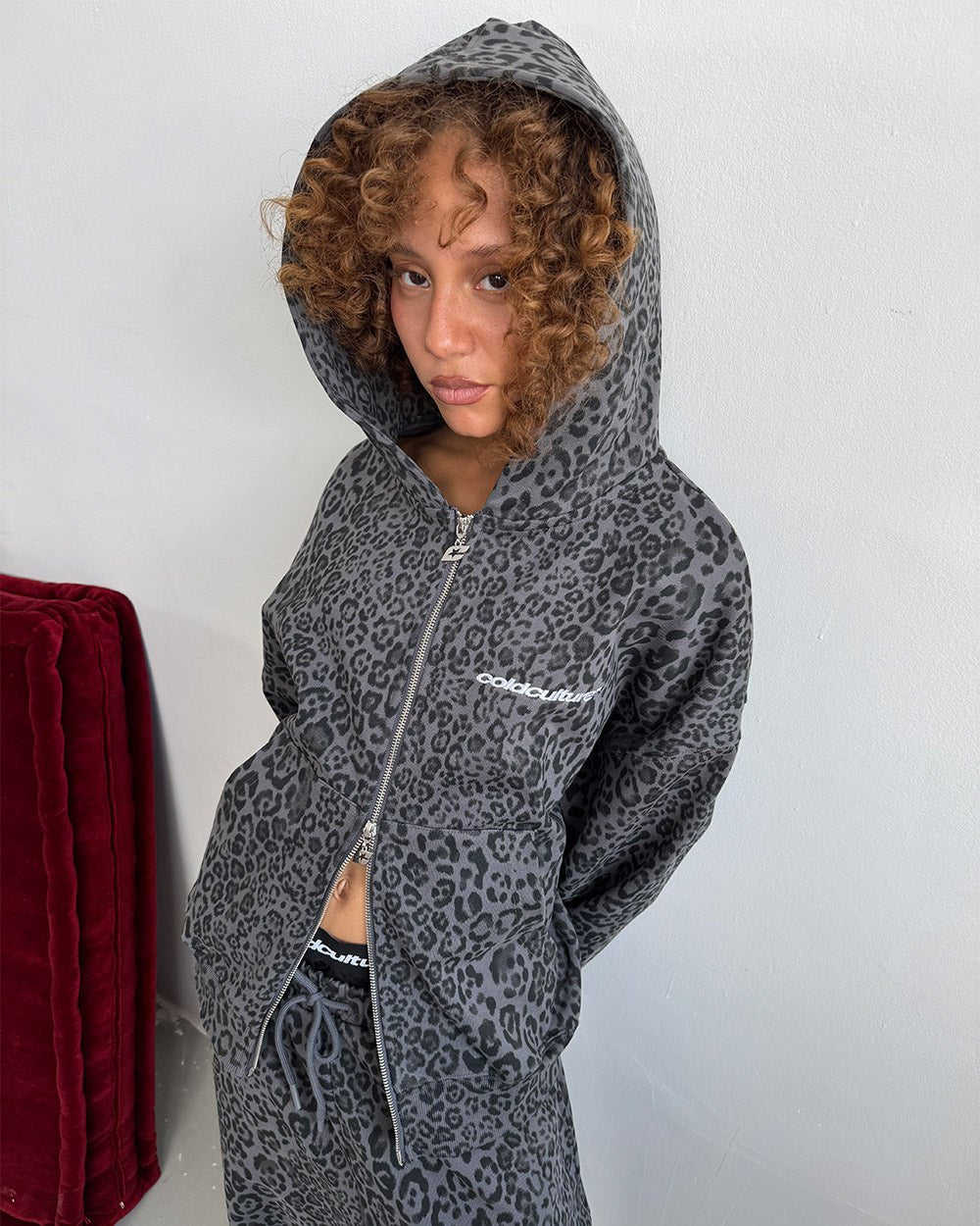 NOCTURNE BEAST SWEATPANTS DARK GREY - dark grey leopard print sweatpants, on model close-up - Cold Culture