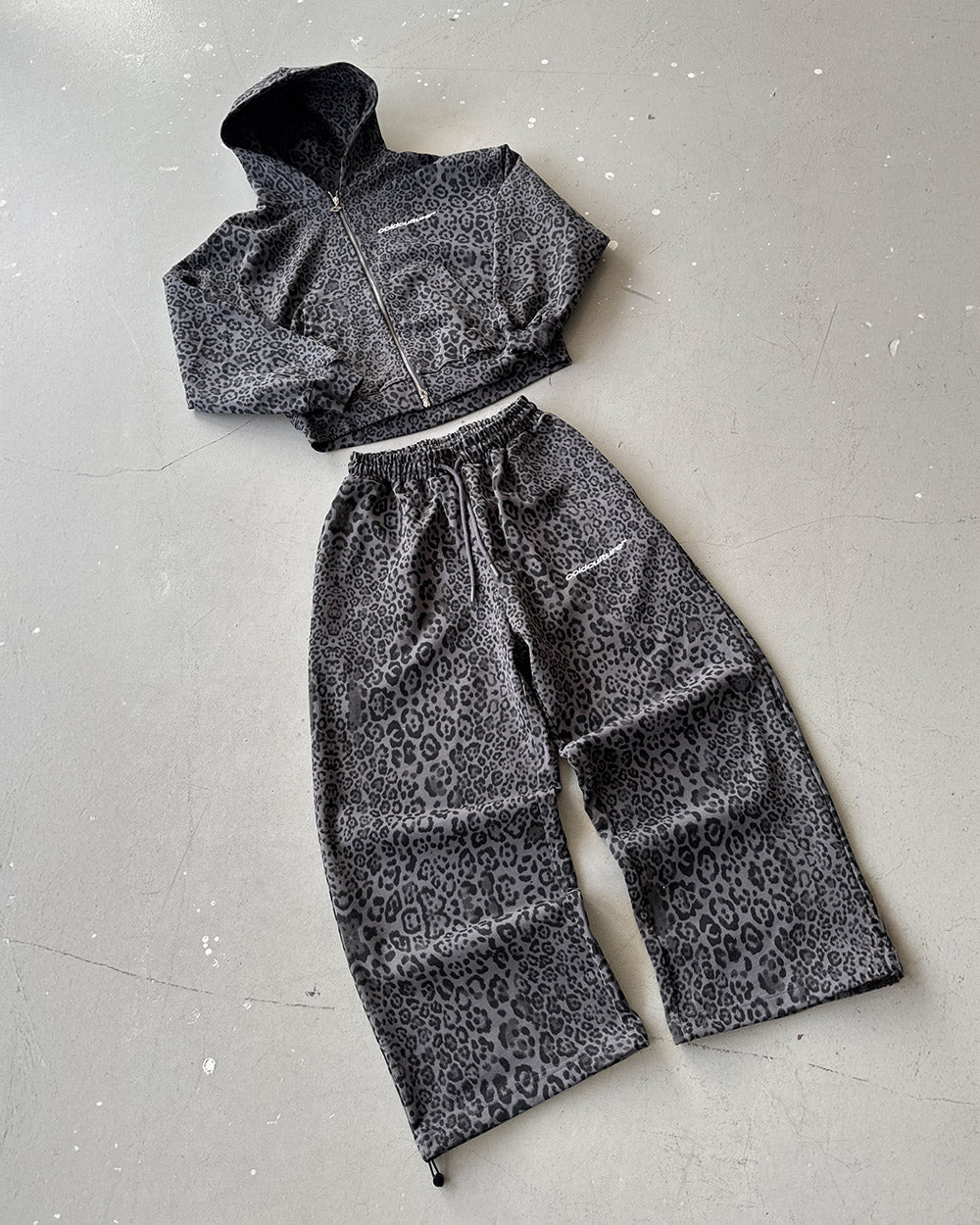NOCTURNE BEAST SWEATPANTS DARK GREY - dark grey leopard print sweatpants, flat lay with matching pieces - Cold Culture