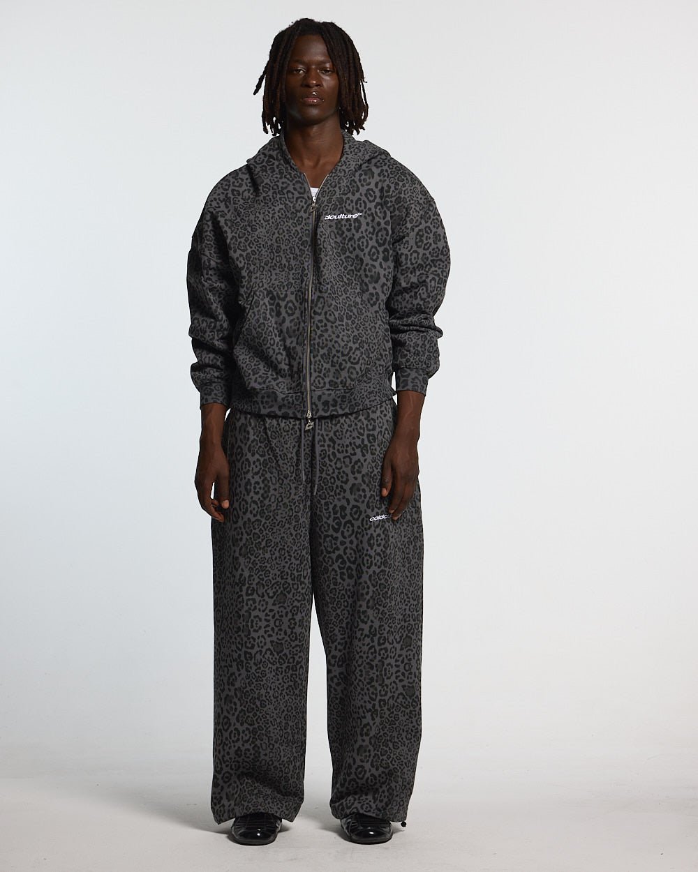 NOCTURNE BEAST SWEATPANTS DARK GREY - dark grey leopard print sweatpants, front view on male model - Cold Culture #man