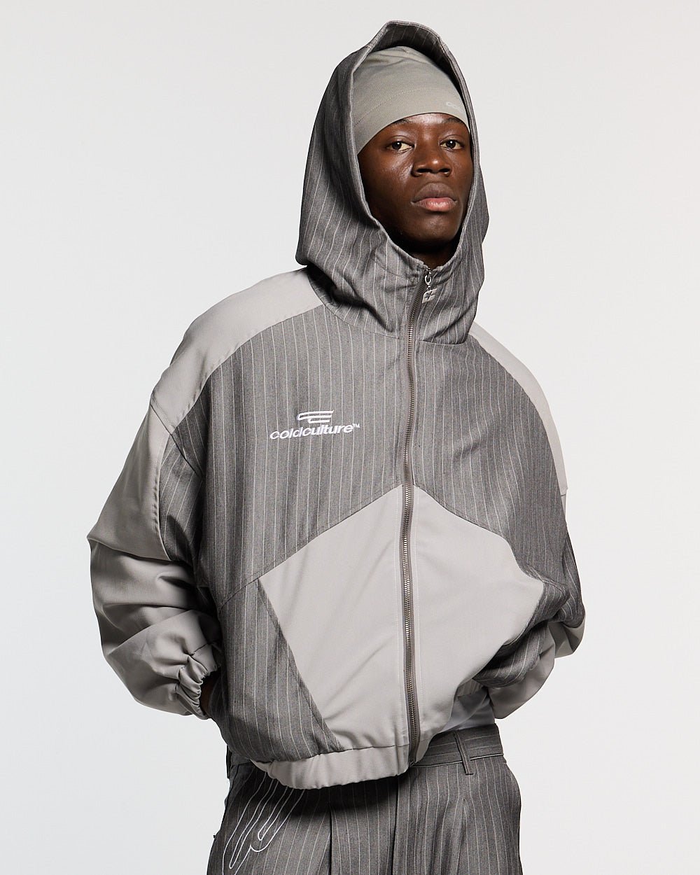 NOT FORMAL SET JACKET GREY - grey pinstripe track jacket, front view on male model - Cold Culture #man