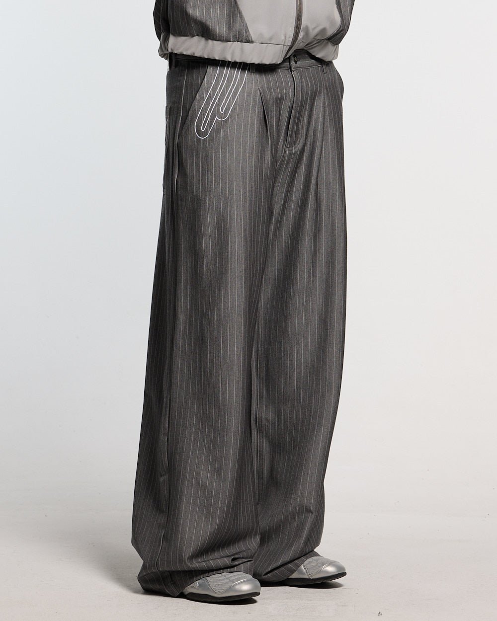 NOT FORMAL SET PANTS GREY - grey pinstripe pants, front view on male model - Cold Culture