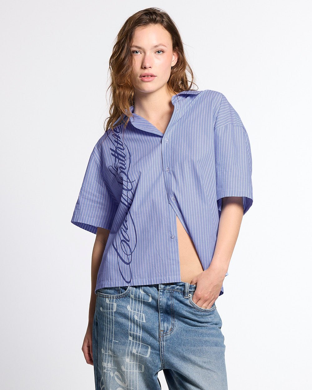 OFFICE SCRIPT SHIRT BLUE - blue striped short sleeve shirt, front view on female model - Cold Culture #woman