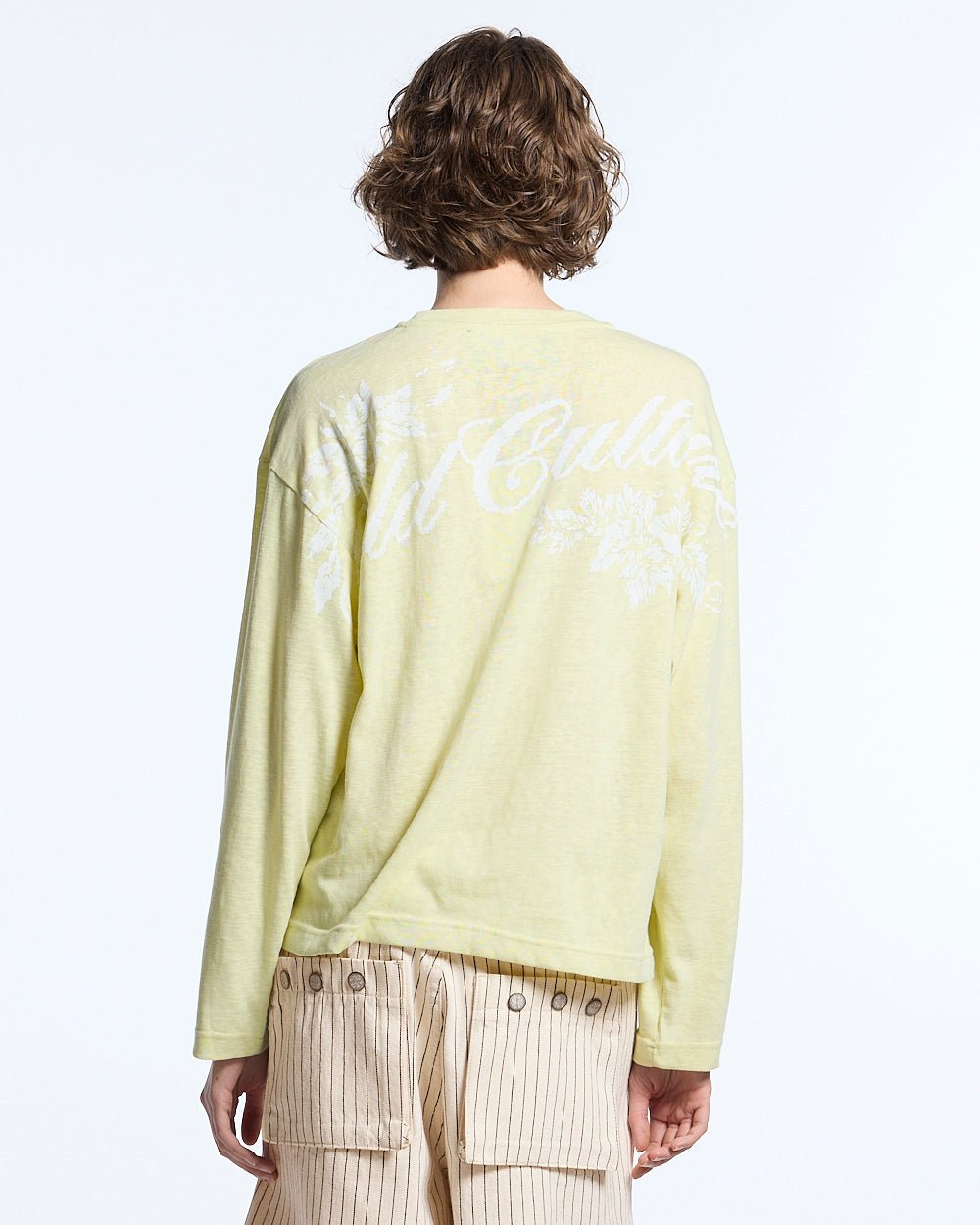 OLD SOUL LONGSLEEVE PALE YELLOW - pale yellow graphic print longsleeve tee, back view on female model - Cold Culture #woman