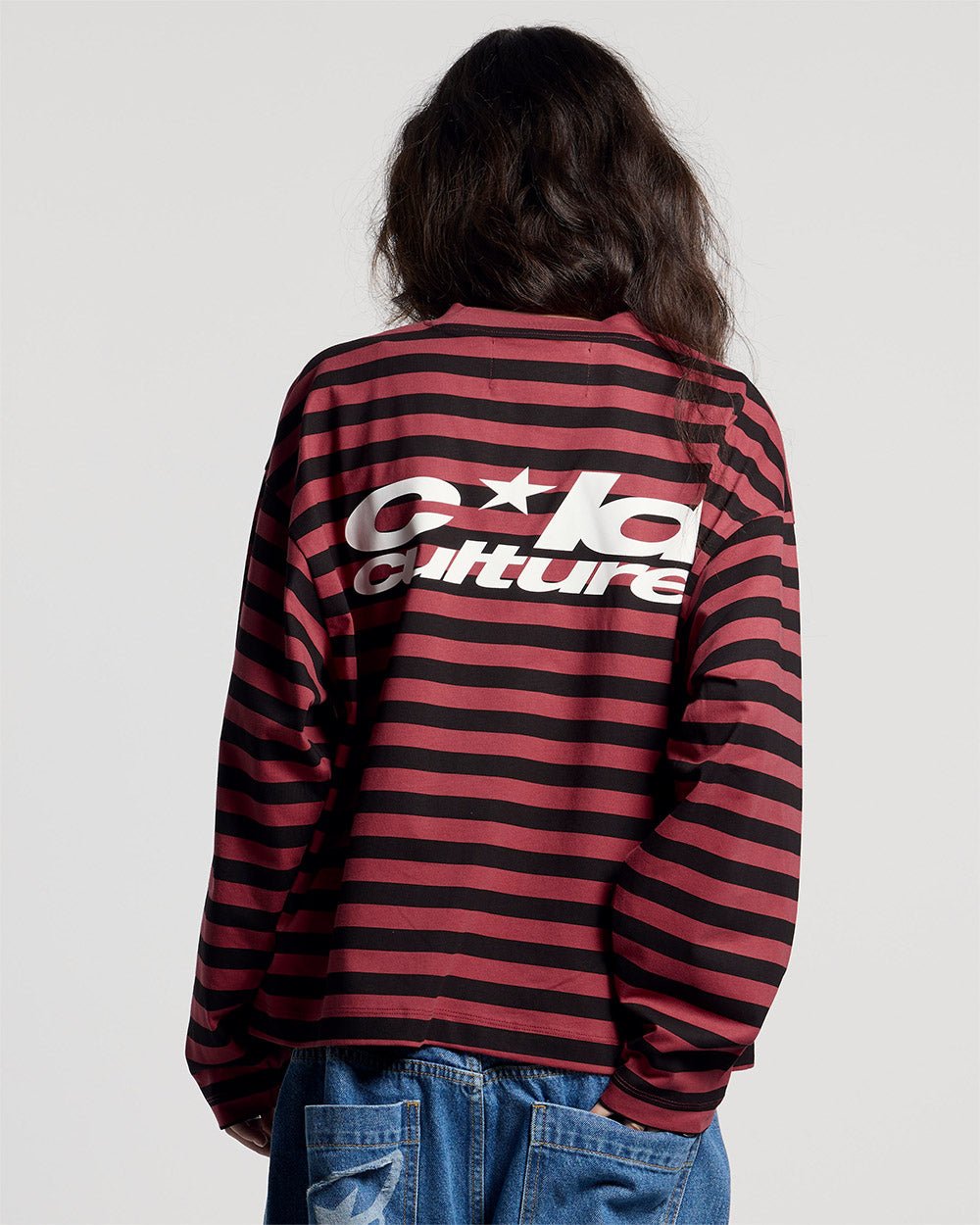 PARDON ME LONGSLEEVE BLACK & RED - black and red striped longsleeve tee, back view on female model - Cold Culture #woman