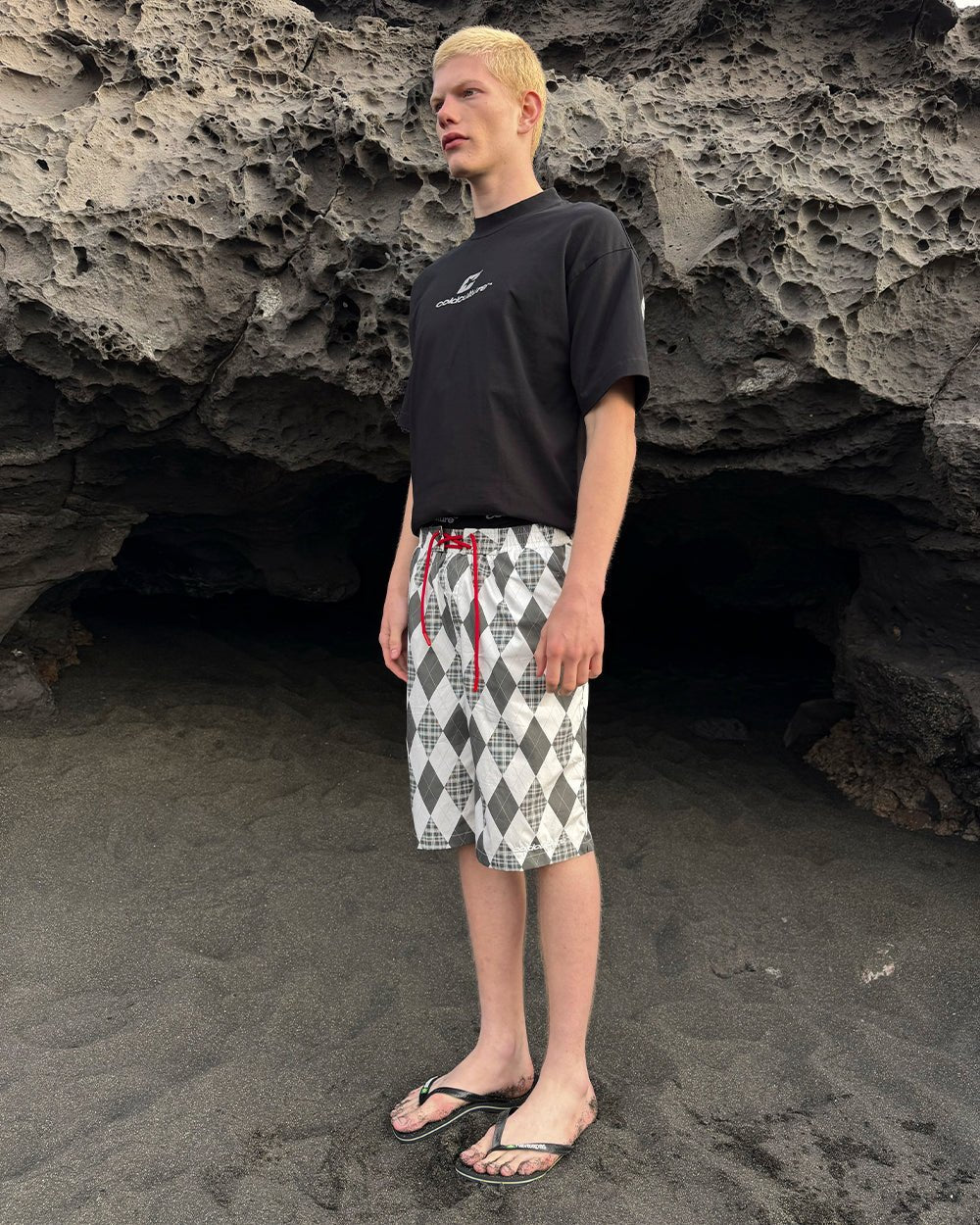 PREPPY SWIMSHORTS WHITE - white argyle swim shorts, street style shot - Cold Culture
