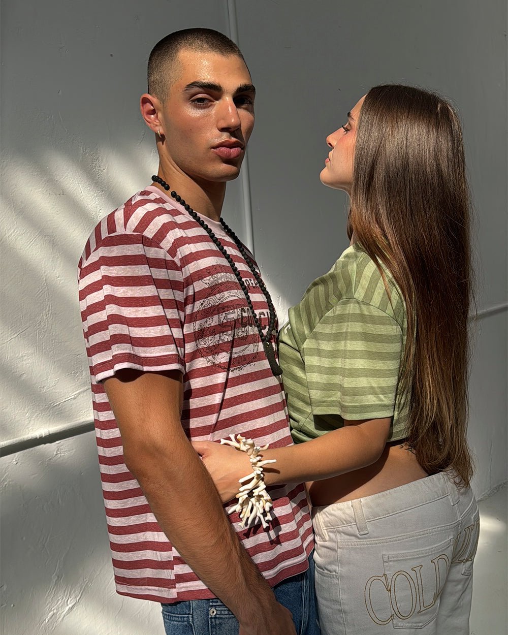 PROPERTY TEE PINK - pink striped tee, front view on male model - Cold Culture