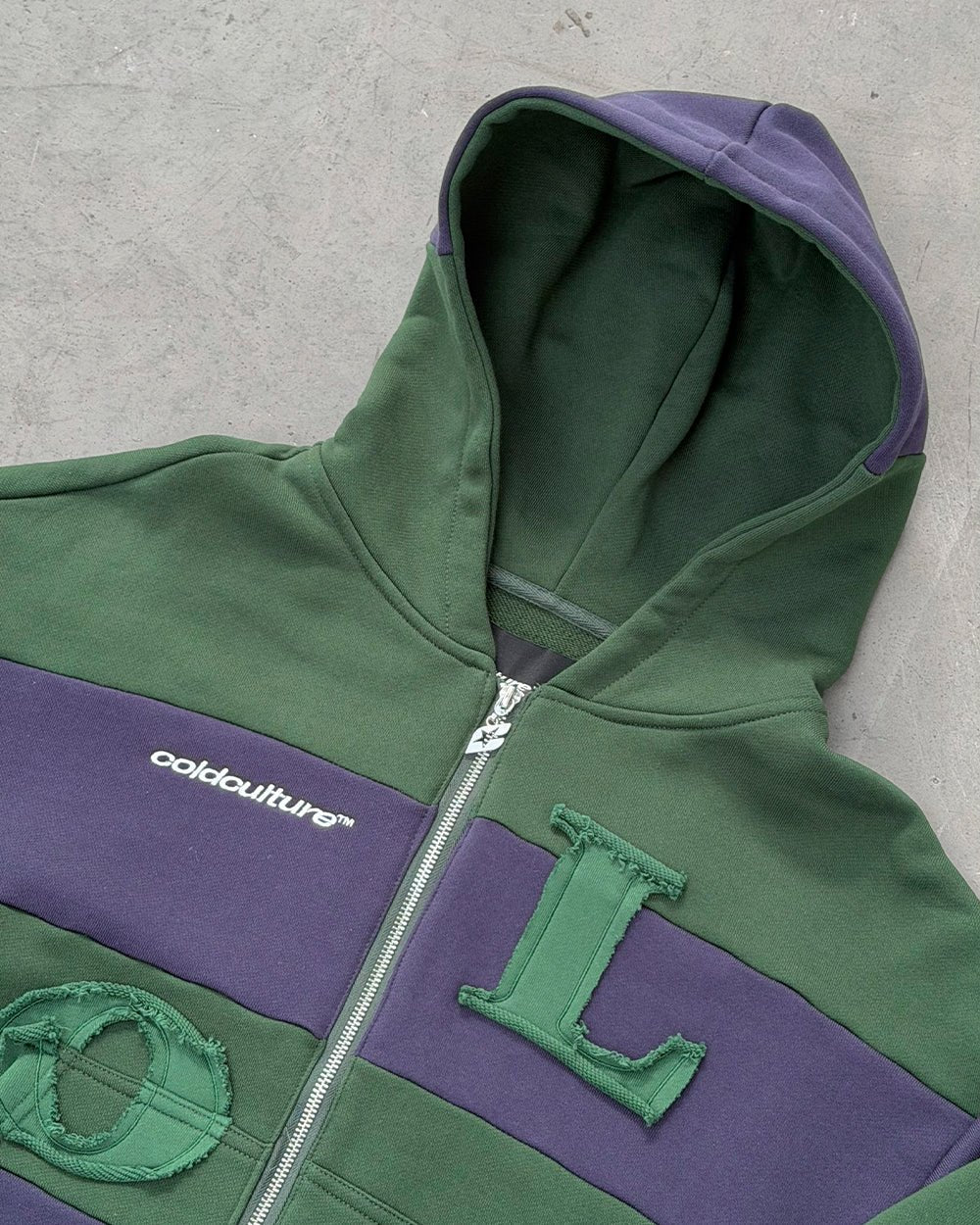 PUZZLE ZIP HOODIE GREEN & NAVY - green and navy striped zip-up hoodie, detail close-up - Cold Culture