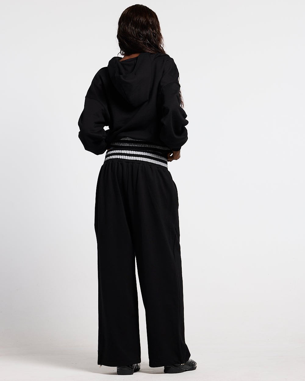 RAGE IN THE RING PANTS  BLACK - black baggy sweatpants, back view on female model - Cold Culture #woman