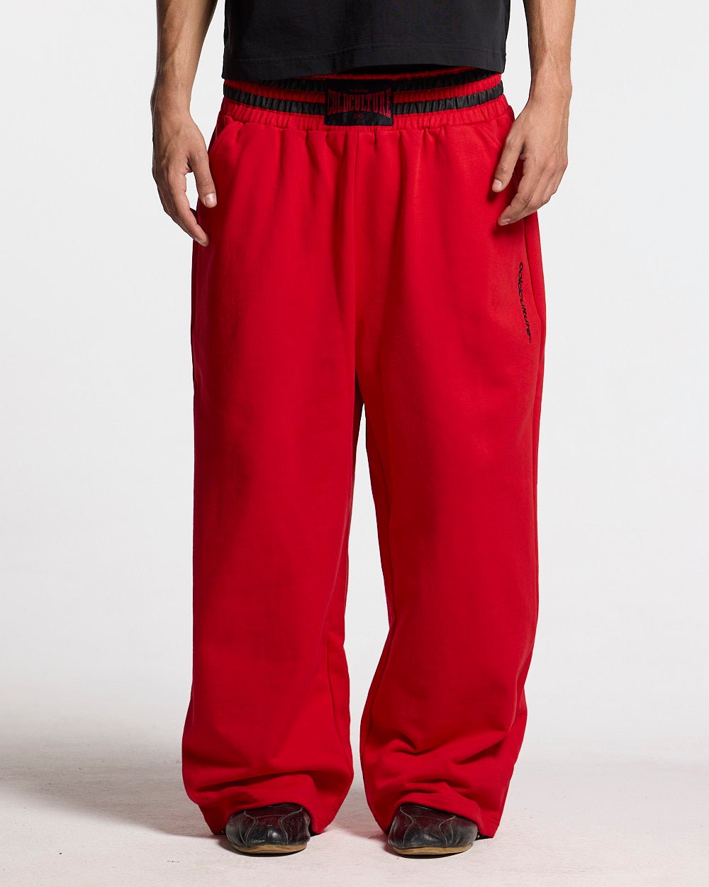 RAGE IN THE RING PANTS RED - red baggy sweatpants, front view on male model - Cold Culture