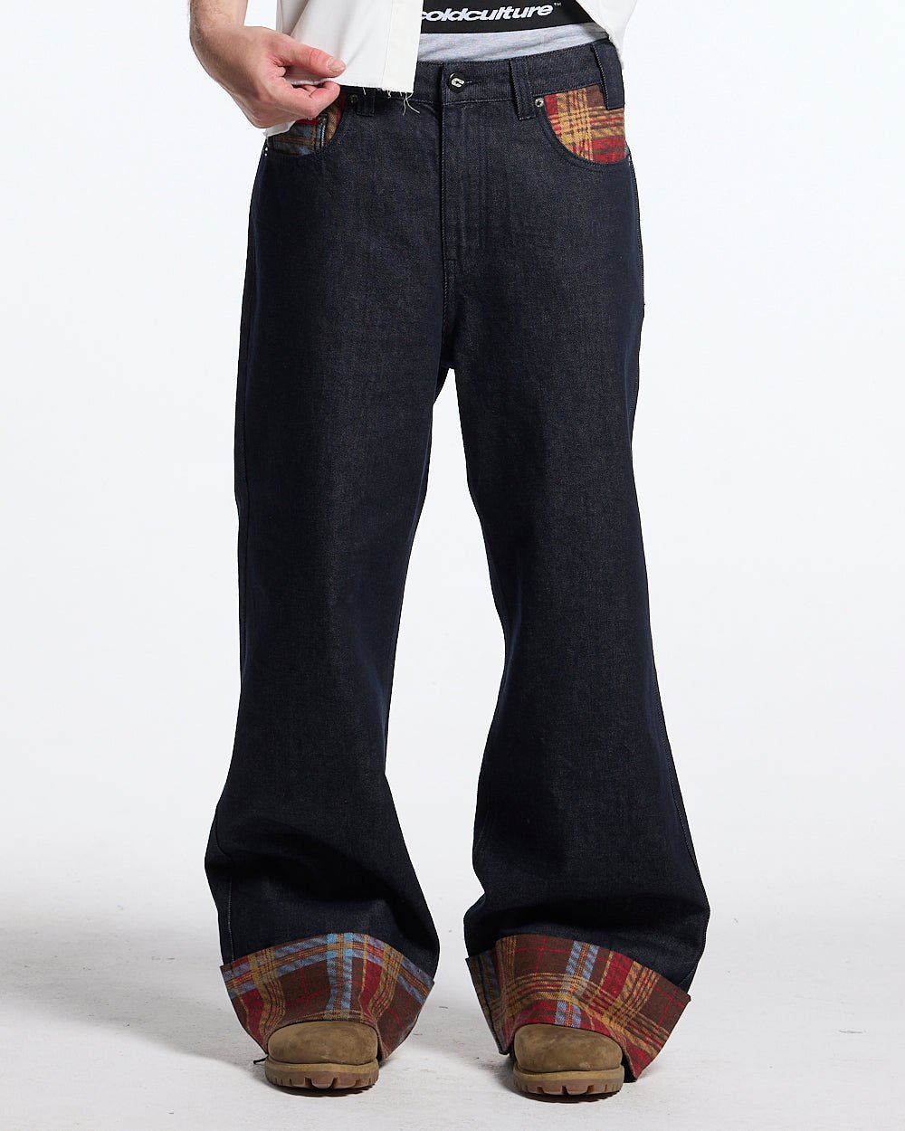 RAINY TARTAN V3 PANTS - navy denim pants with tartan cuffs, front view on male model - Cold Culture
