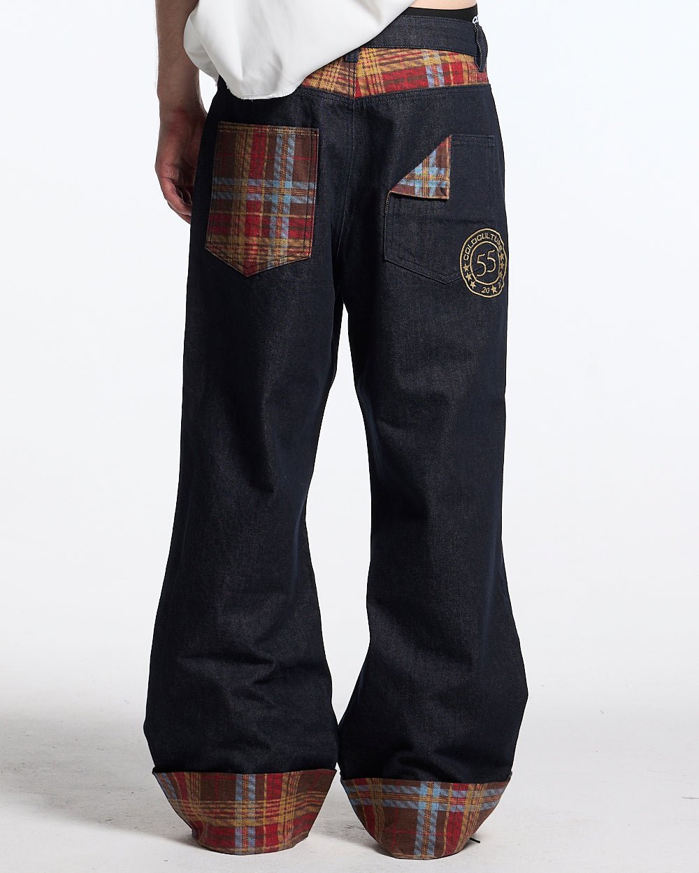 RAINY TARTAN V3 PANTS - navy denim pants with tartan cuffs, back view on male model - Cold Culture