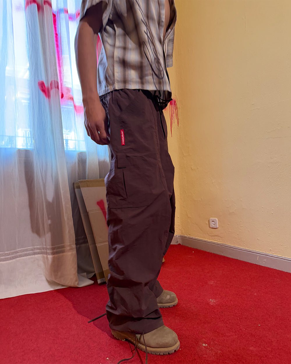 RESERVED CARGO PANTS BROWN - brown nylon cargo pants, street style shot - Cold Culture