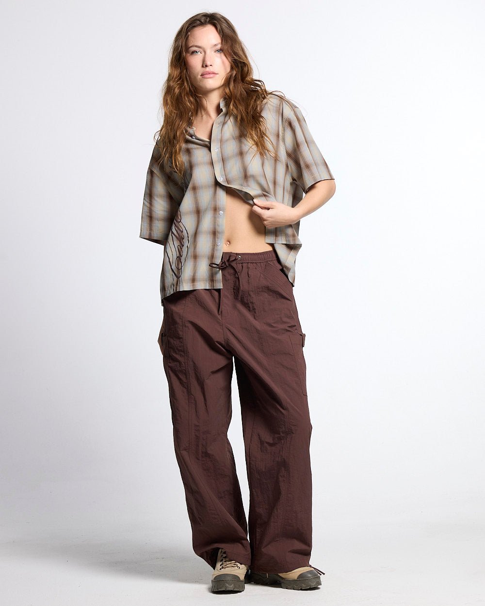RESERVED CARGO PANTS BROWN - brown nylon cargo pants, front view on female model - Cold Culture #woman