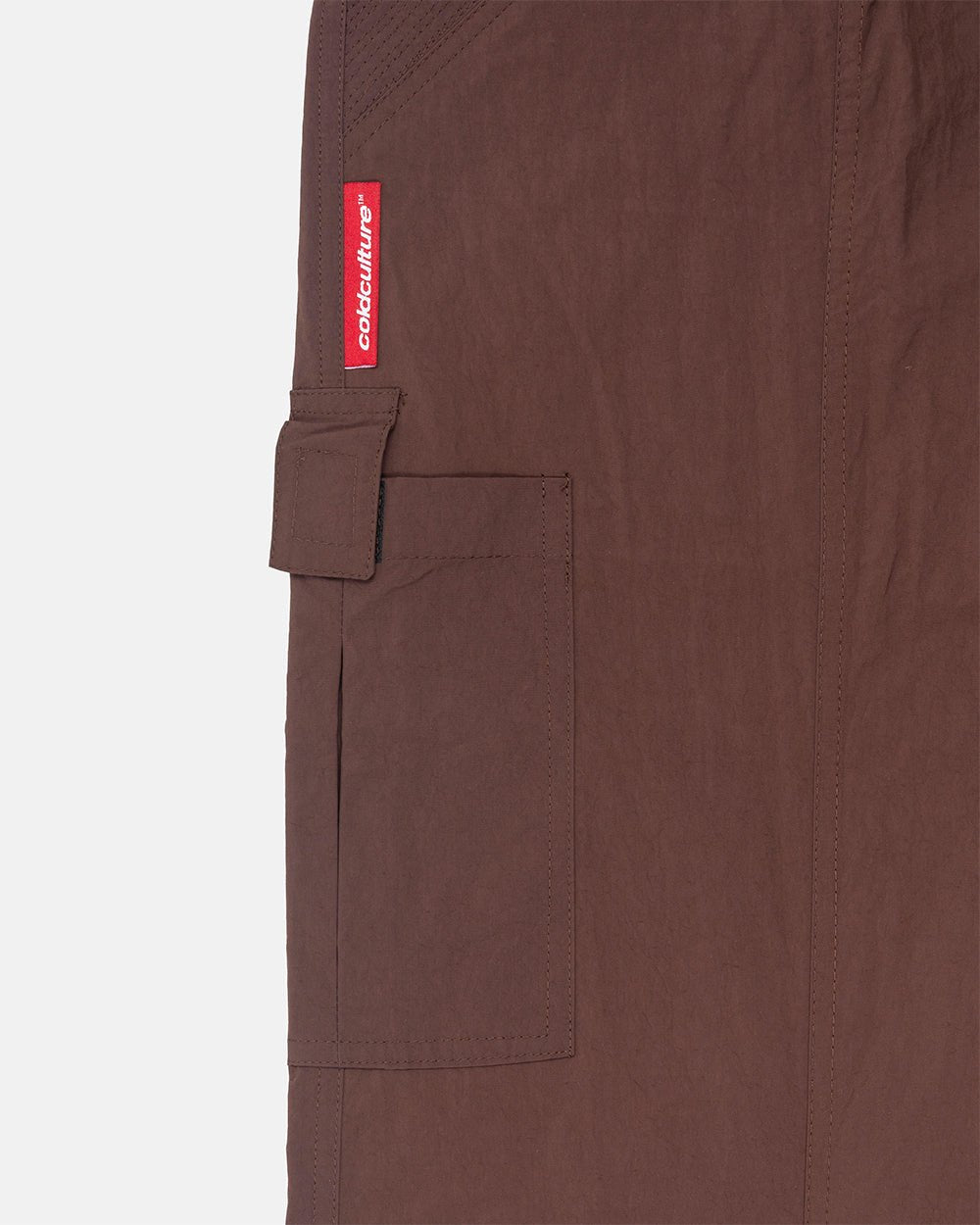 RESERVED CARGO PANTS BROWN - brown nylon cargo pants, detail close-up - Cold Culture