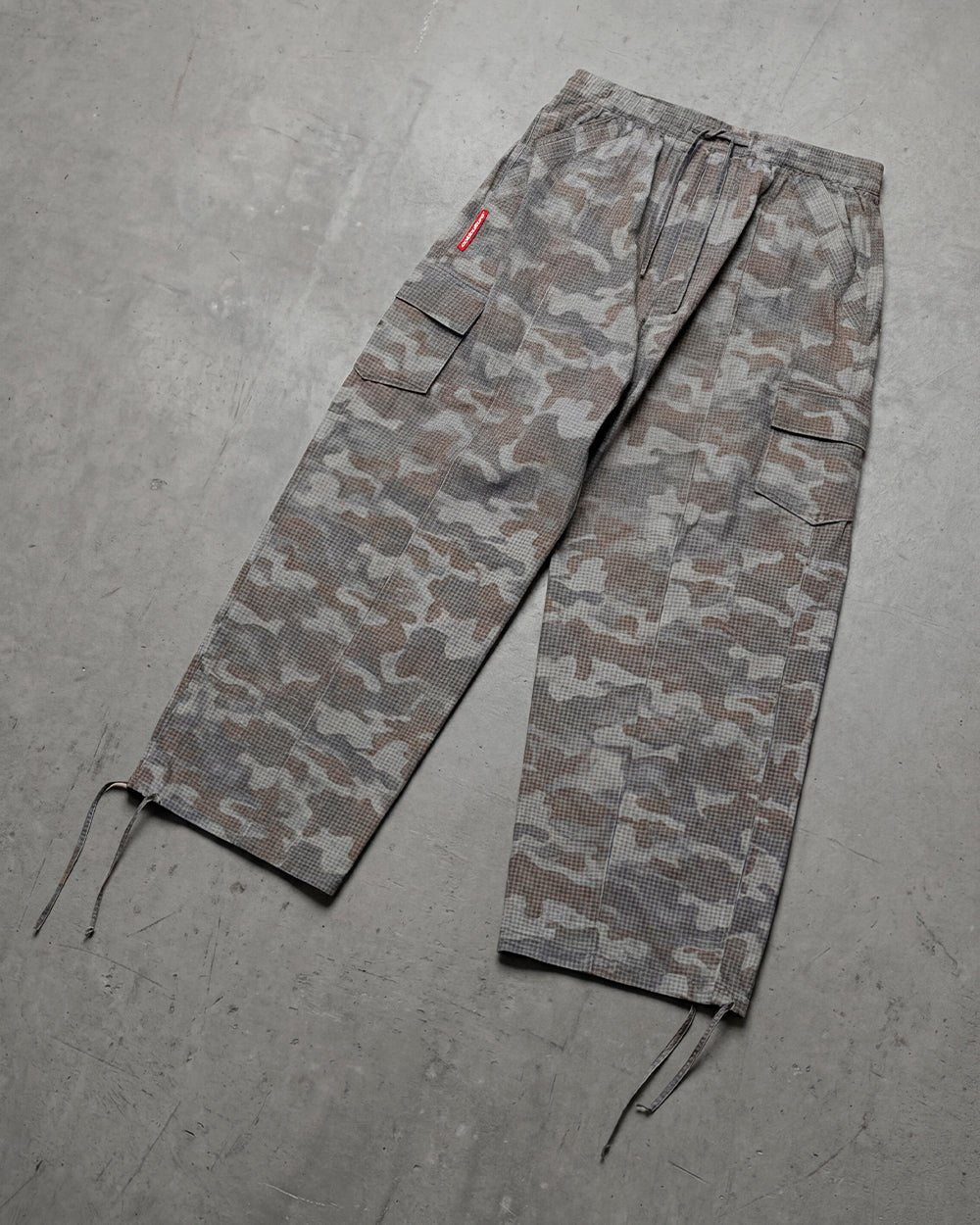 RESERVED CARGO PANTS CAMO - grey camo cargo pants, flat lay - Cold Culture
