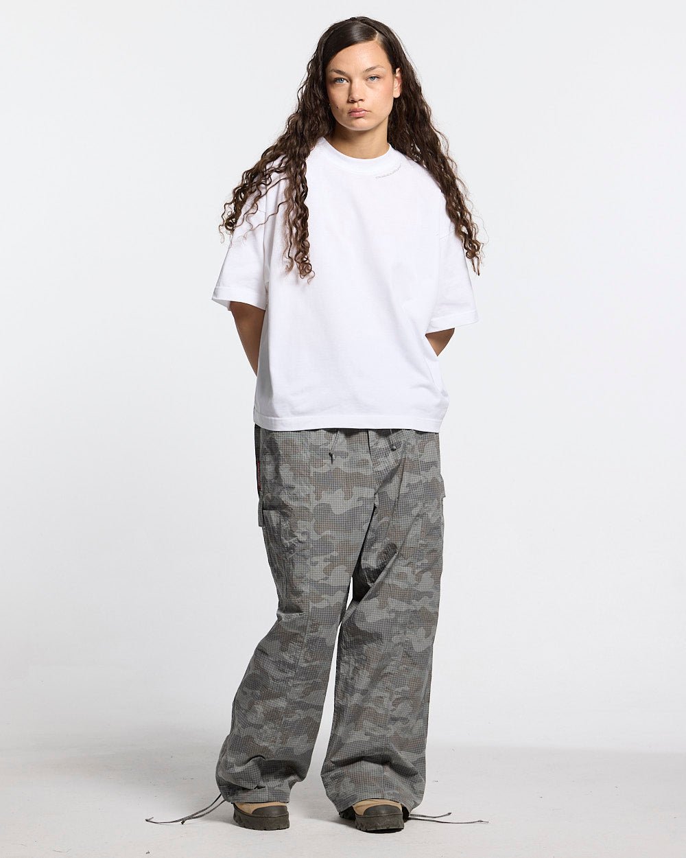 RESERVED CARGO PANTS CAMO - grey camo cargo pants, front view on female model - Cold Culture #woman