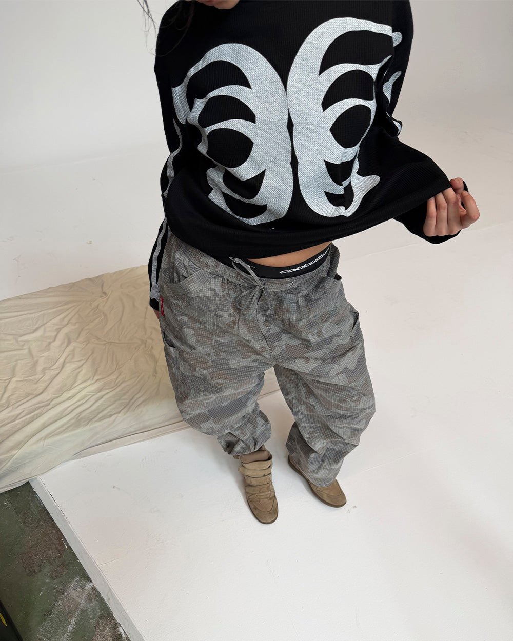 RESERVED CARGO PANTS CAMO - grey camo cargo pants, street style shot - Cold Culture