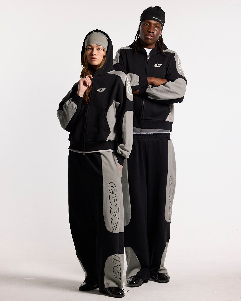 RIDER SWEATPANTS BLACK & GREY - black and grey paneled sweatpants, front view on female model - Cold Culture