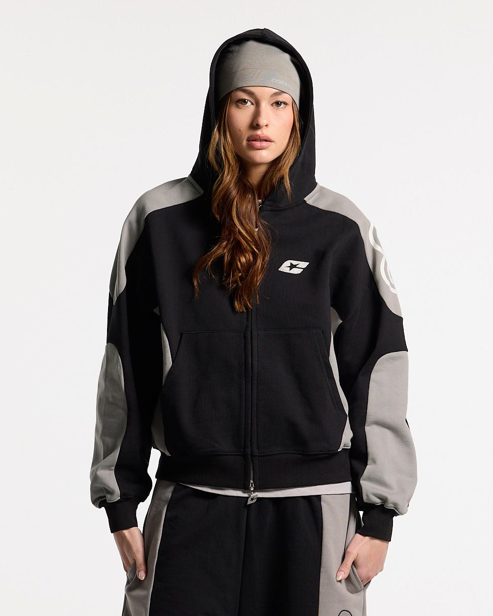 RIDER ZIP HOODIE BLACK & GREY - black and grey zip-up hoodie, front view on female model - Cold Culture #woman