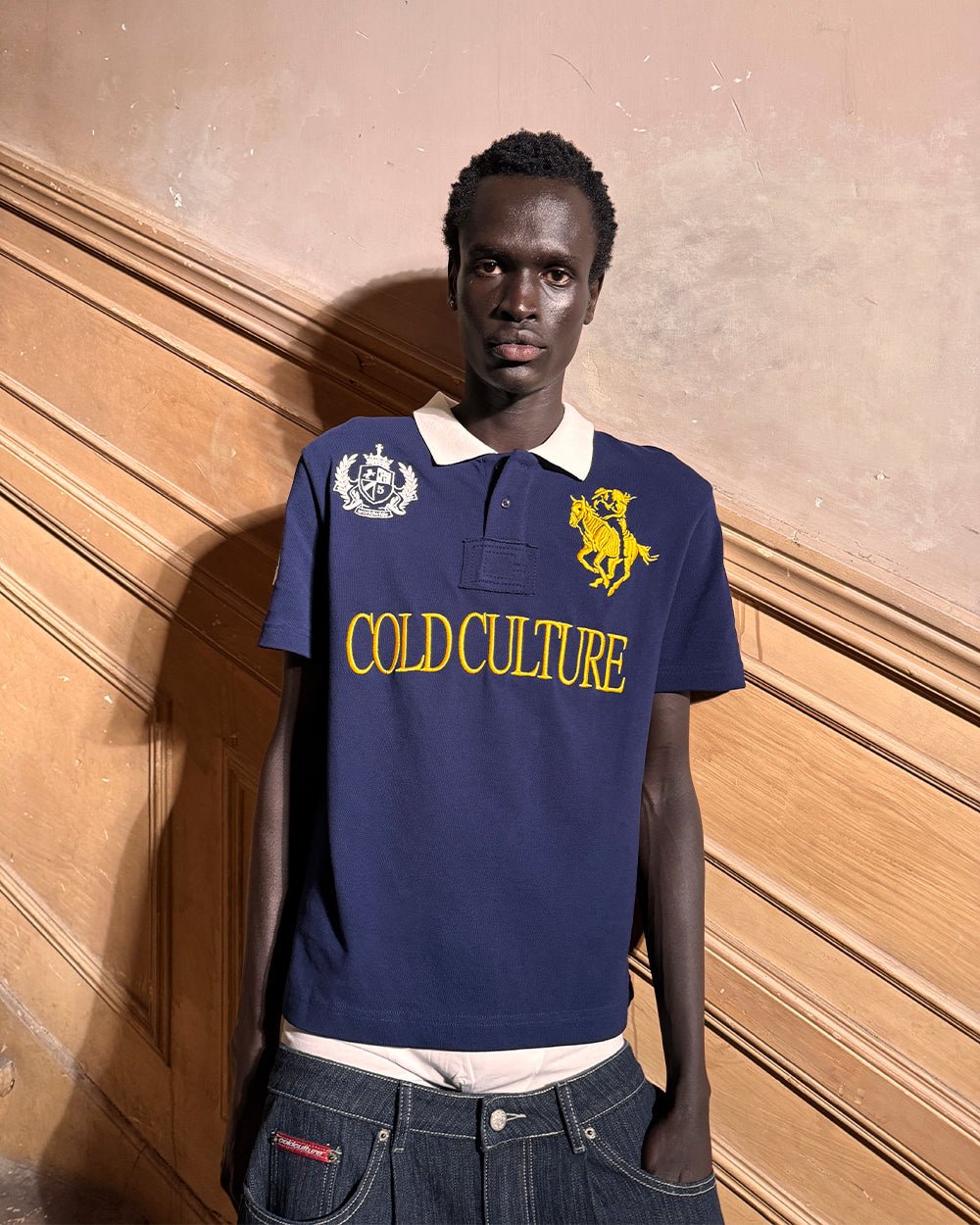 RIDING CLUB POLO NAVY - navy embroidered polo shirt, street style shot - Cold Culture