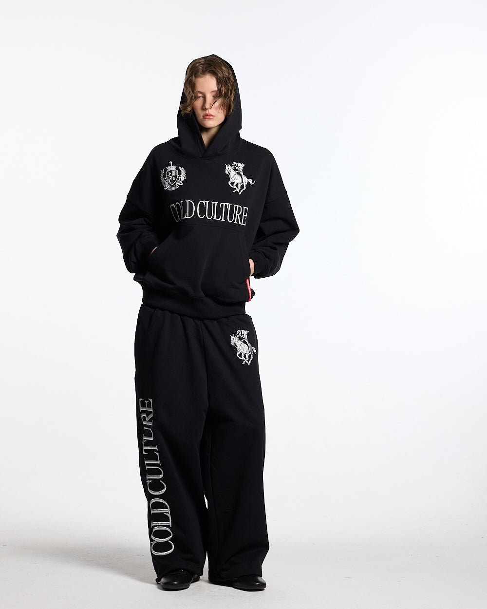 RIDING CLUB SWEATPANTS BLACK - black embroidered sweatpants, front view on female model - Cold Culture #woman
