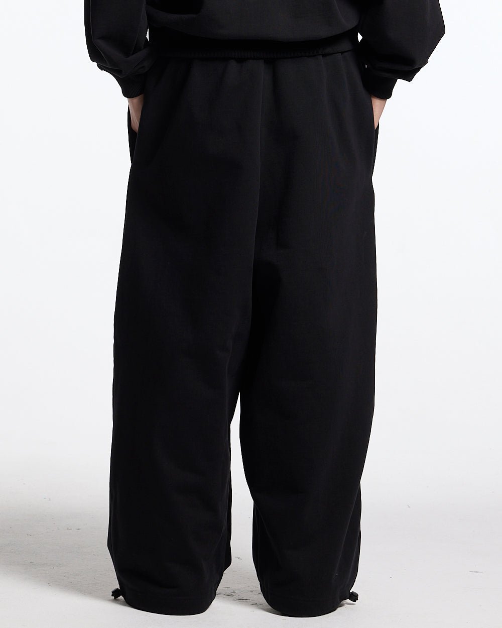 RIDING CLUB SWEATPANTS BLACK - black embroidered sweatpants, back view on male model - Cold Culture