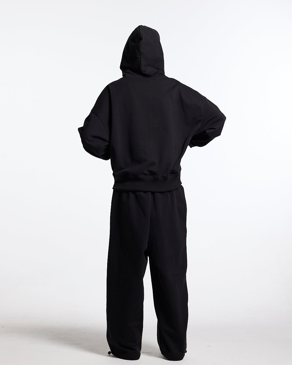 RIDING CLUB SWEATPANTS BLACK - black embroidered sweatpants, back view on female model - Cold Culture