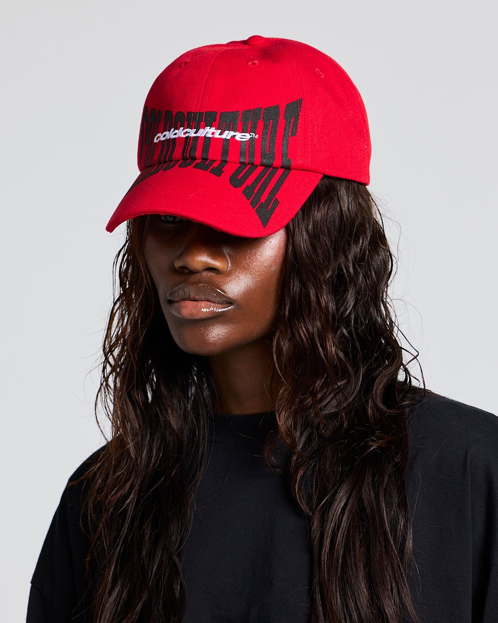 RIOT CAP RED - red logo print cap, on model close-up - Cold Culture #woman