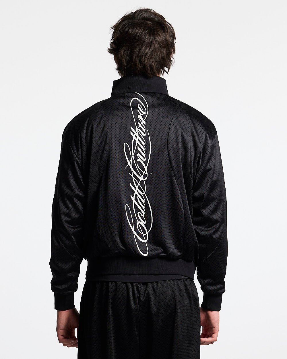 RIOT MESH JACKET BLACK - black mesh track jacket, back view on male model - Cold Culture #man
