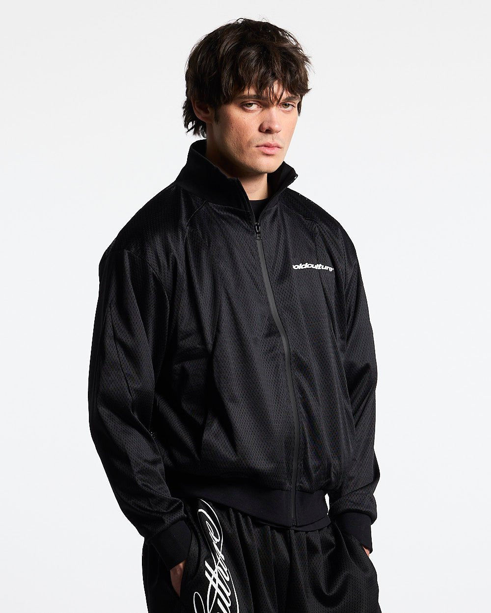 RIOT MESH JACKET BLACK - black mesh track jacket, front view on male model - Cold Culture #man